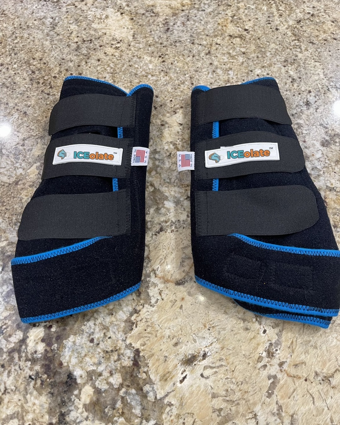 Pair of black ICEolate™ boots with teal trim